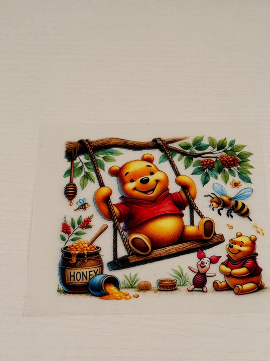Winnie the Pooh on swing